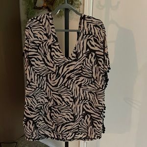 Animal print cover up with a black sun hat